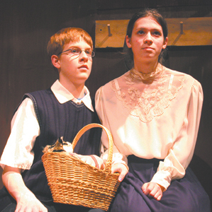 Peter, played by Paul Berghoff, and Anne, played by Becca Coffelt, welcome Mouchi, the cat, to their hiding place. The Diary of Anne Frank opens at Elmhurst High School on Thursday, December 7, 2006 at 7:30pm.     Tickets available at the door. 